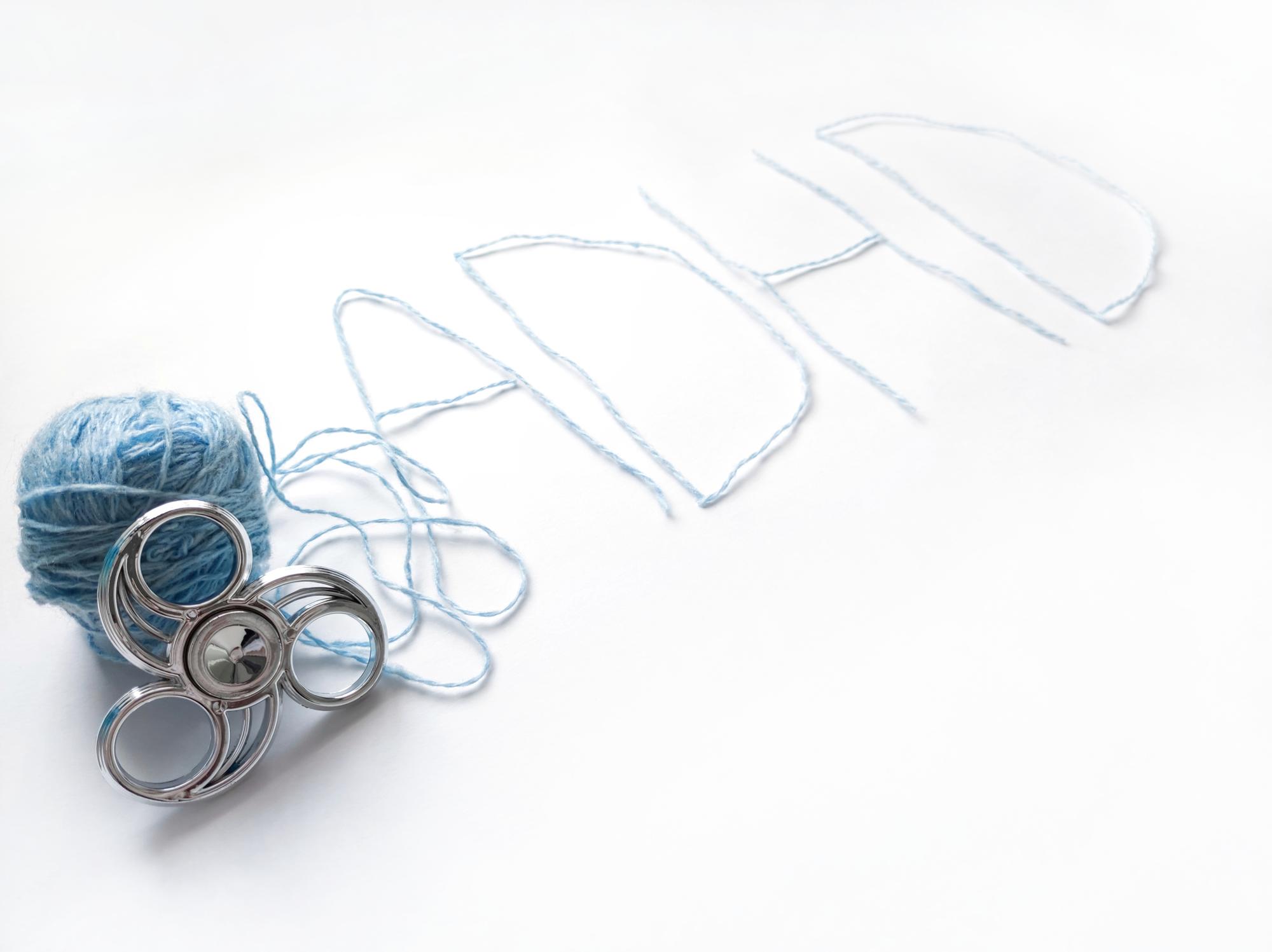 atelier workspace with threads, hoops and pattern sketches
